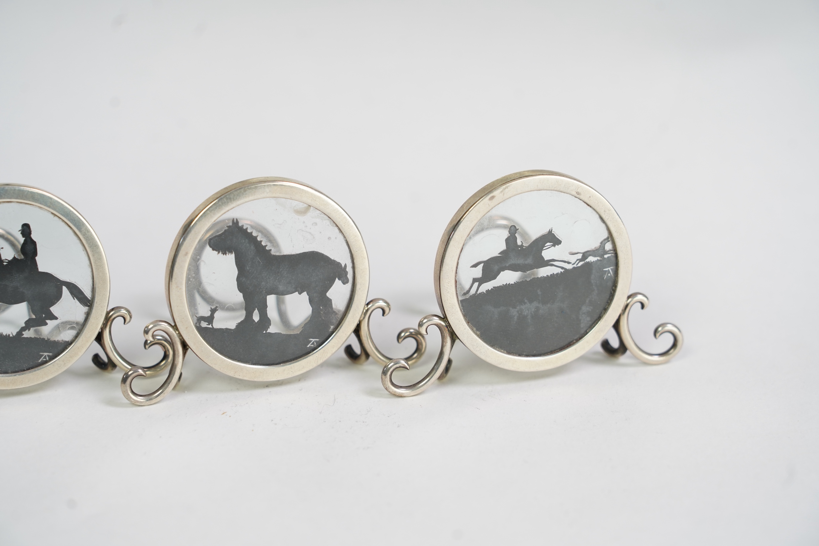 A set of four Edwardian silver menu holders, by Elkington & Co